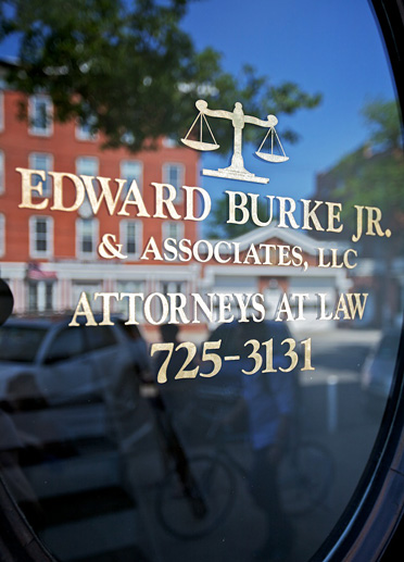 image of the window with the Edward Burke Jr. company information