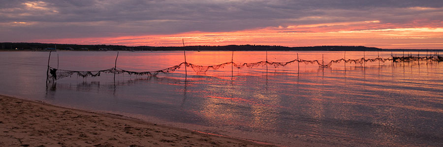 image of sunset across a small bay or lake